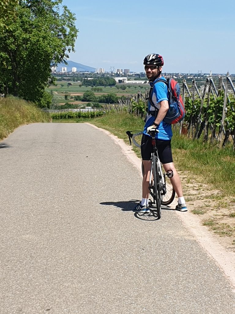 Road & Bike Trip: My tour guide and driver. Cycling towards Colmar.